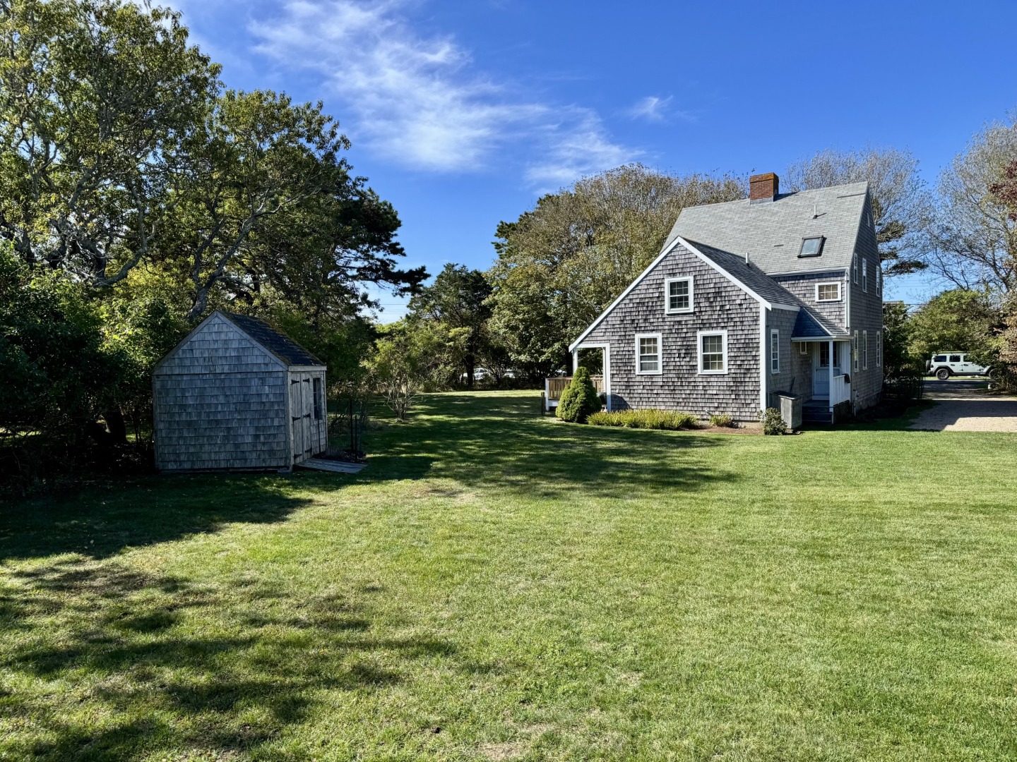 35 Sankaty Road Nantucket, MA 02554 - Photo 4 of 12 a view of a big house with a big yard and large trees