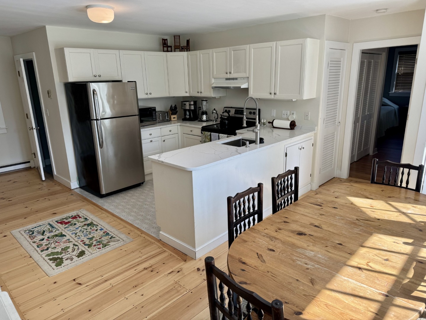 35 Sankaty Road Nantucket, MA 02554 - Photo 8 of 12 a kitchen with a refrigerator a stove a sink dishwasher and wooden cabinets