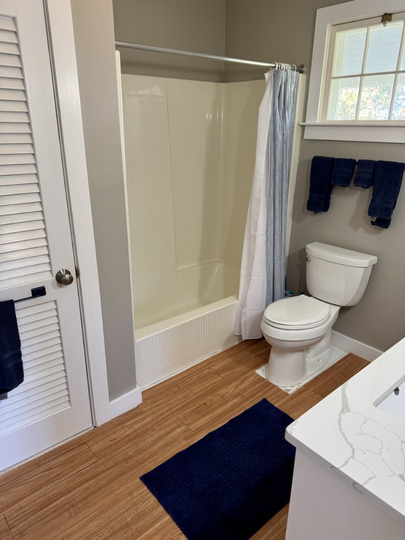 35 Sankaty Road Nantucket, MA 02554 - Photo 10 of 12 a bathroom with a sink a toilet a window and shower
