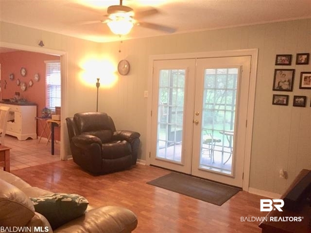 5925 Dixie Lane Mobile, AL 36693 - Photo 8 of 19 Living room with a healthy amount of sunlight, hardwood / wood-style floors, ceiling fan, and french doors