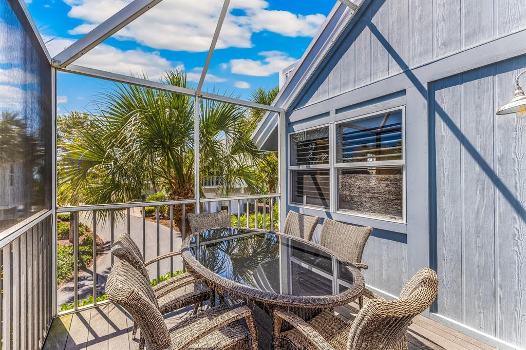 5000 Gasparilla Road, Unit 19 Boca Grande, FL 33921 - Photo 20 of 48 a view of a chair and table in the balcony