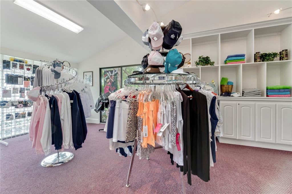 5000 Gasparilla Road, Unit 19 Boca Grande, FL 33921 - Photo 36 of 48 a view of walk in closet with clothes and shoes