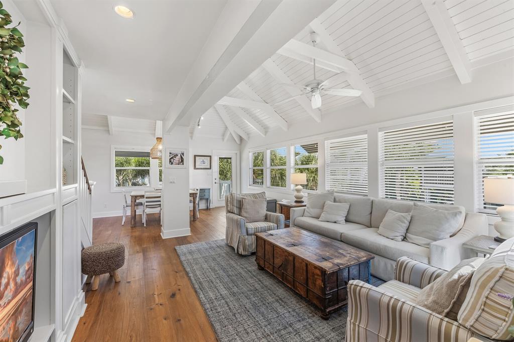 5000 Gasparilla Road, Unit 19 Boca Grande, FL 33921 - Photo 5 of 48 a living room with furniture and a fireplace