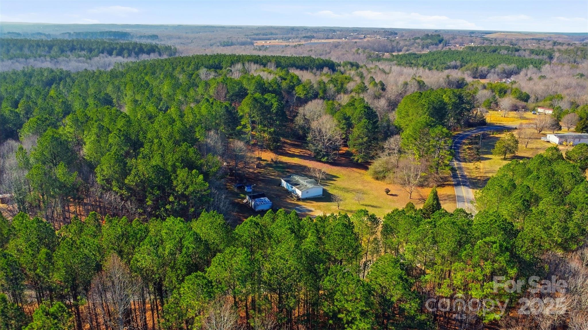 a view of a lake with green field
