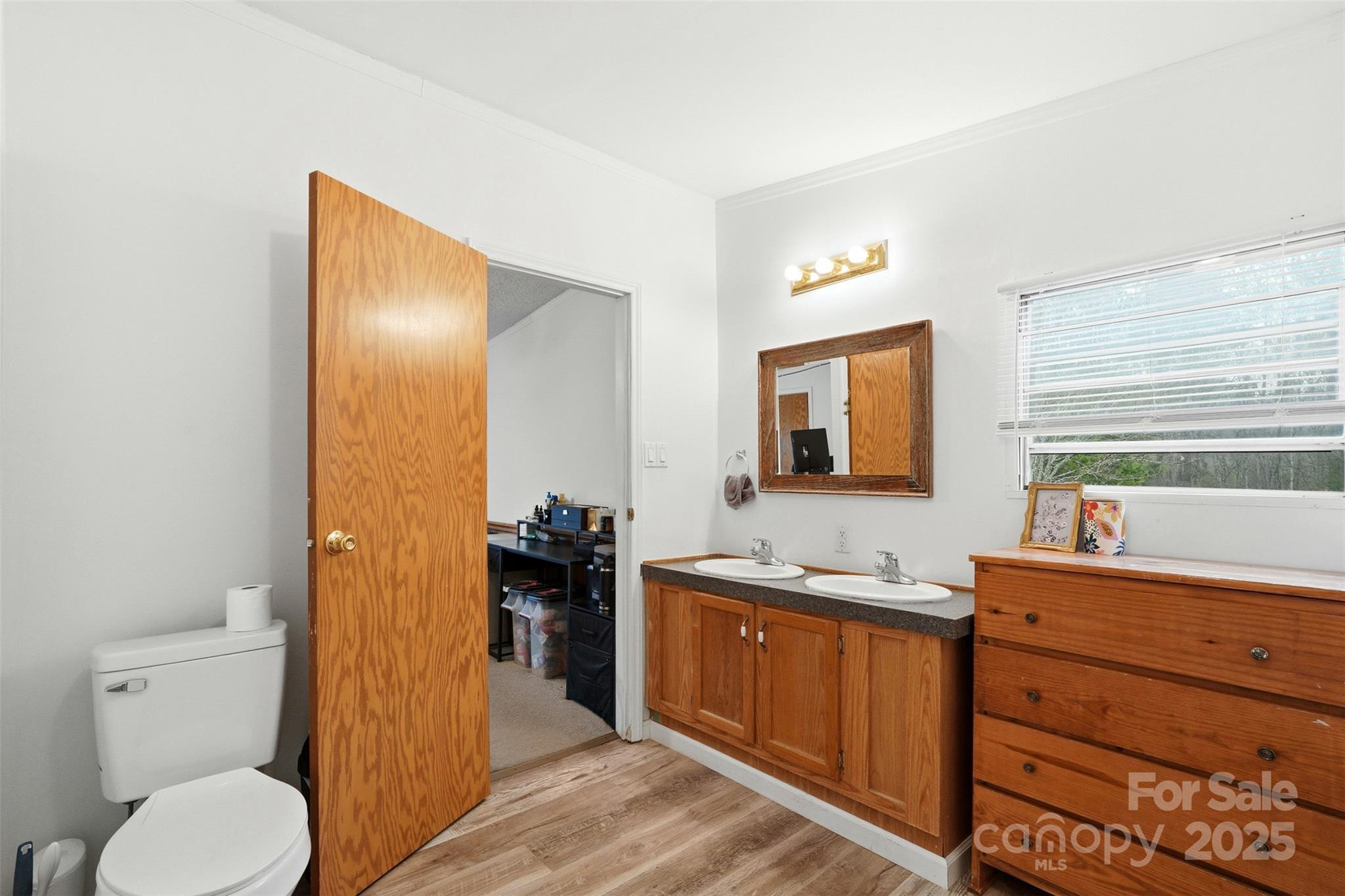2338 Whelchel Road Mooresboro, NC 28114 - Photo 13 of 20 a bathroom with a toilet sink and mirror