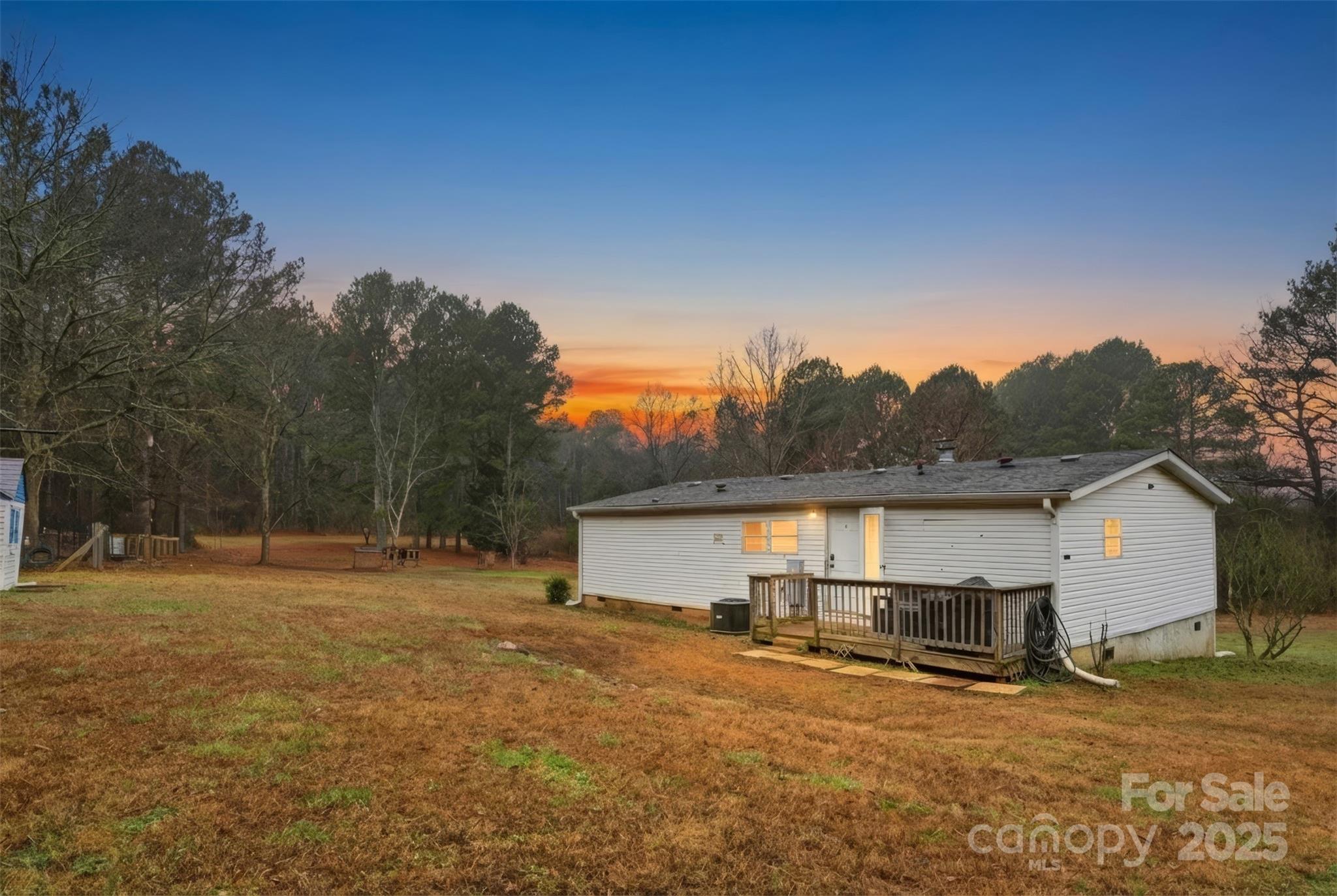 2338 Whelchel Road Mooresboro, NC 28114 - Photo 17 of 20 a view of backyard of house and car parked