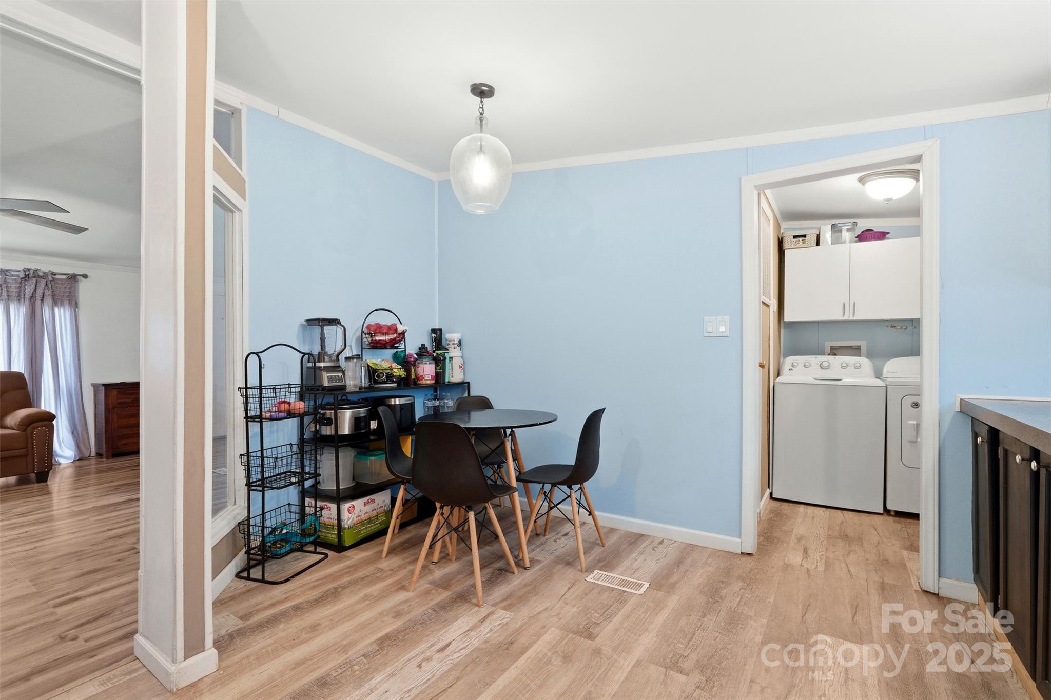 2338 Whelchel Road Mooresboro, NC 28114 - Photo 5 of 20 a view of a dining room with furniture and wooden floor