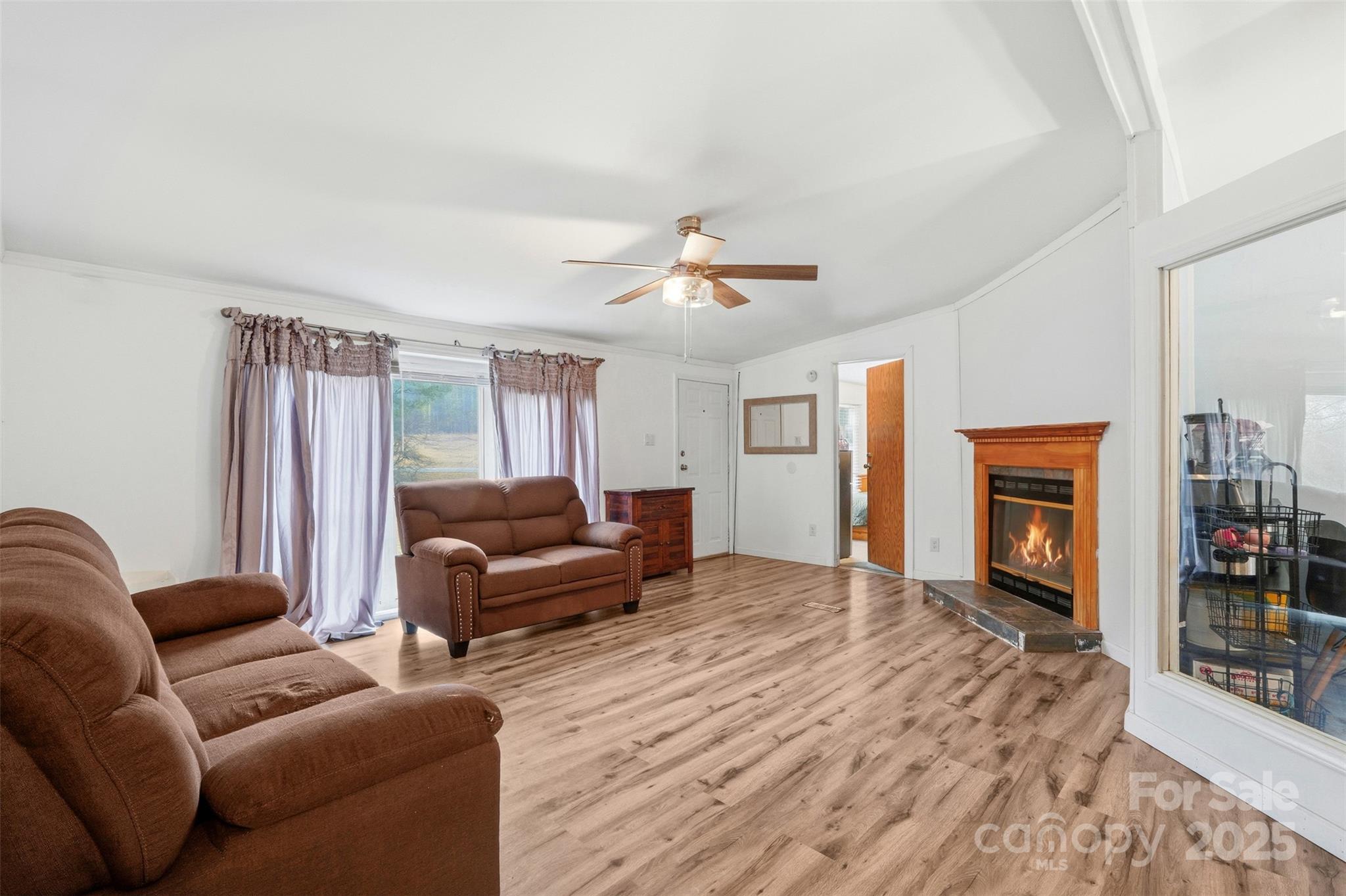 2338 Whelchel Road Mooresboro, NC 28114 - Photo 7 of 20 a living room with furniture and a fireplace