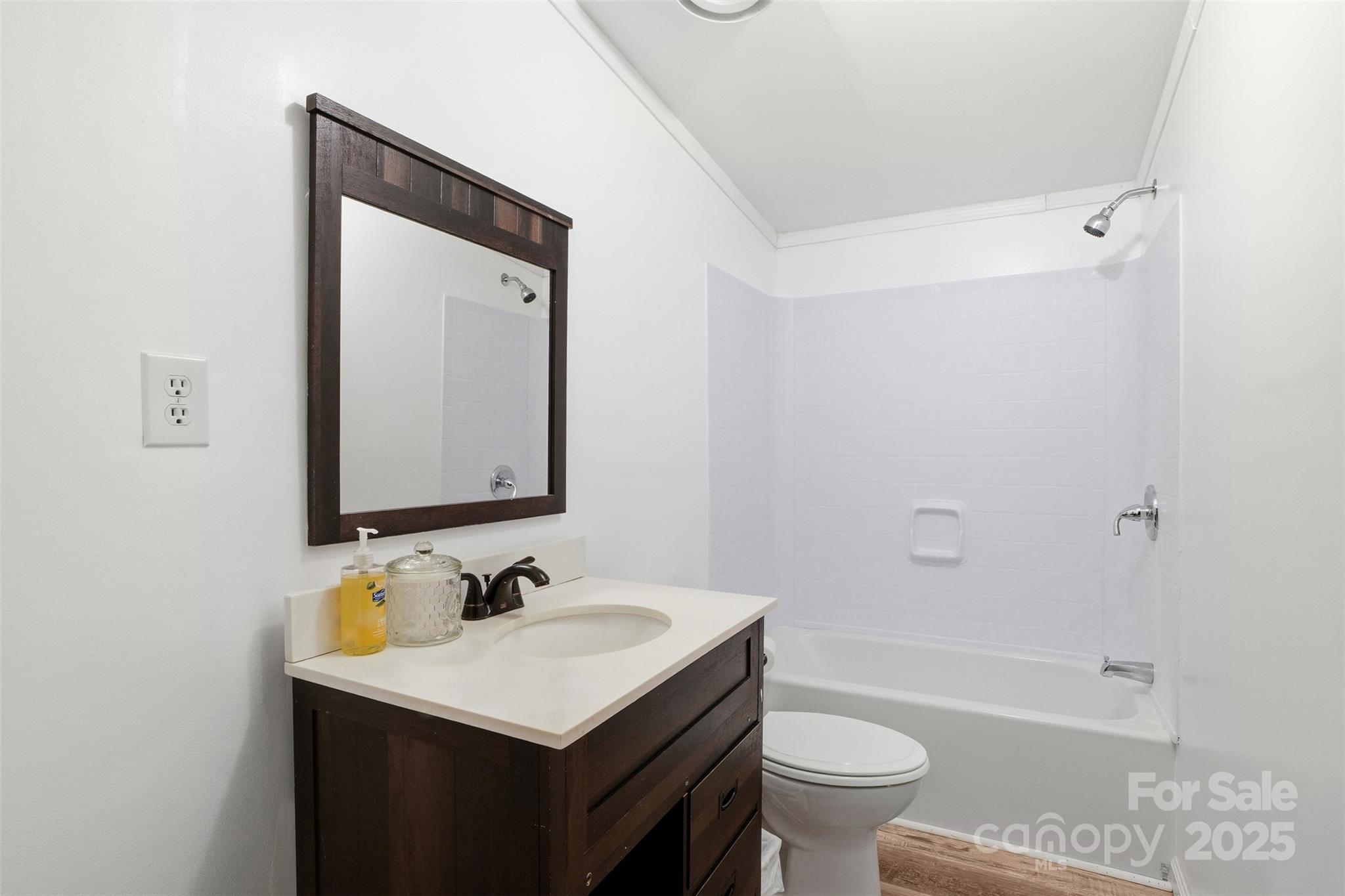 2338 Whelchel Road Mooresboro, NC 28114 - Photo 10 of 20 a bathroom with a sink toilet vanity and shower