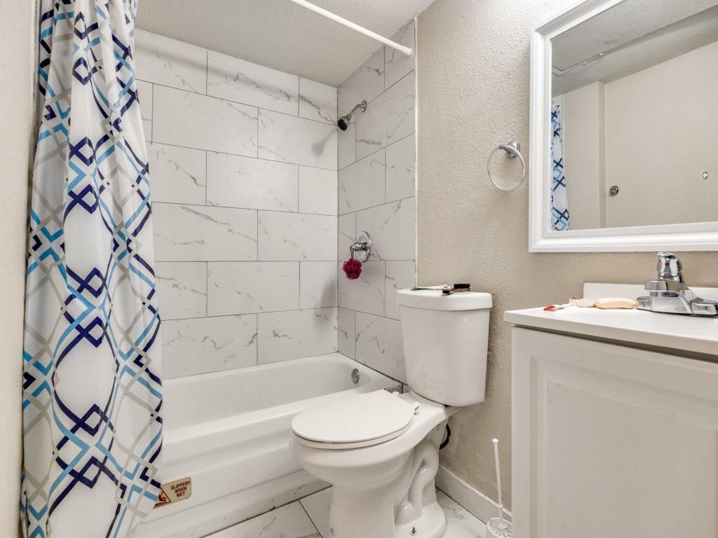 9809 Walnut Street, Unit 203 Dallas, TX 75243 - Photo 8 of 12 a bathroom with a sink toilet and shower