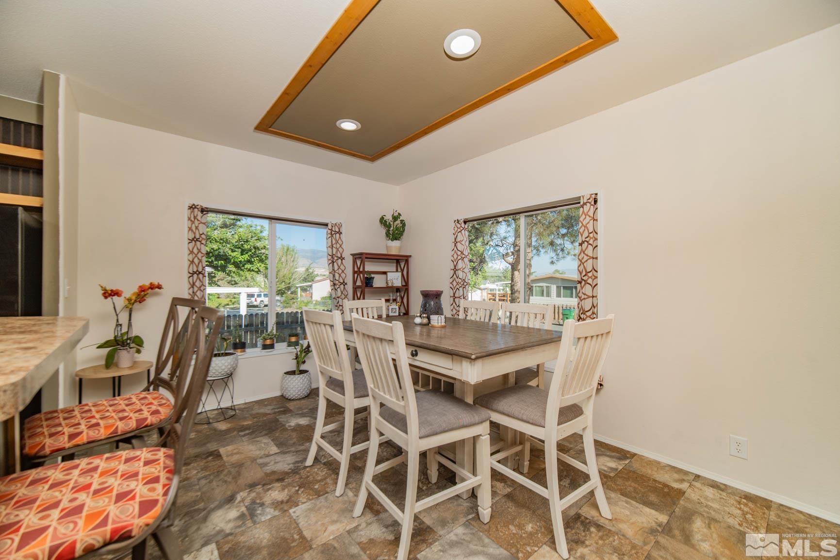 16210 Rhyolite Circle Reno, NV 89521 - Photo 14 of 39 a dining room with furniture and a large window
