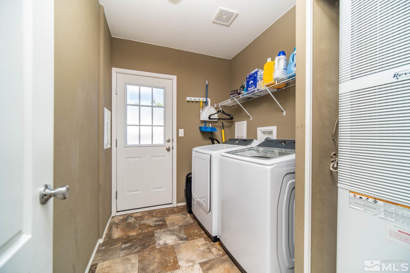 16210 Rhyolite Circle Reno, NV 89521 - Photo 22 of 39 a utility room with dryer and washer