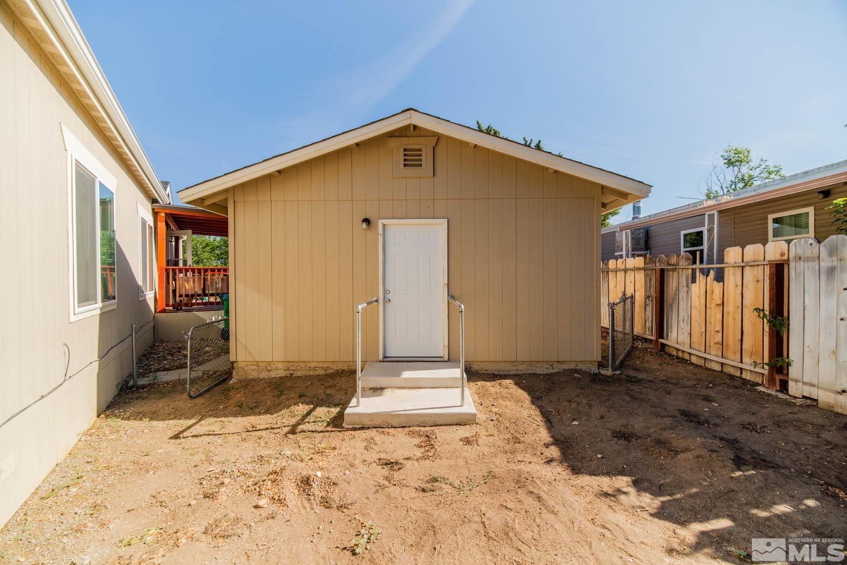 16210 Rhyolite Circle Reno, NV 89521 - Photo 25 of 39 a front view of a house with a yard