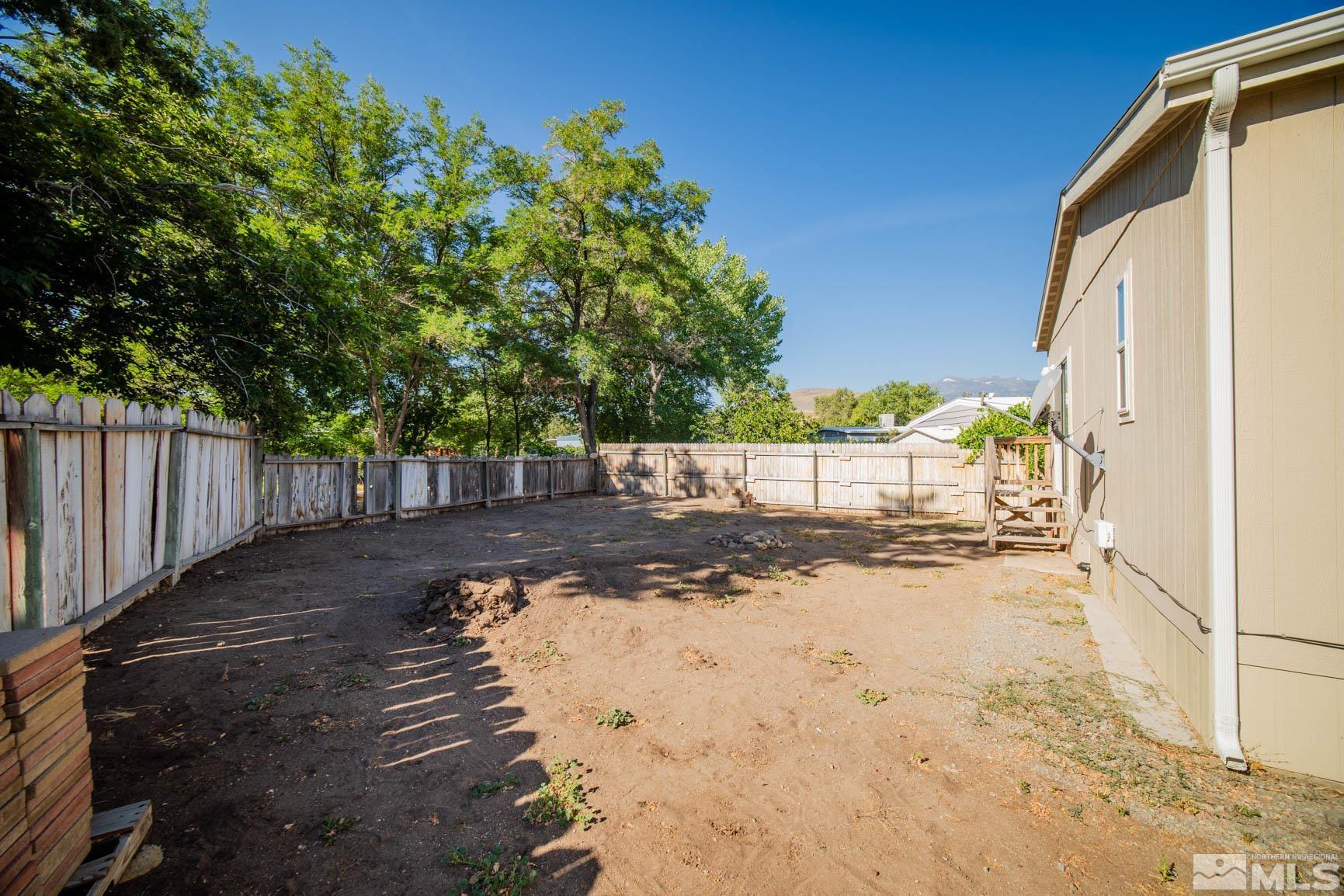 16210 Rhyolite Circle Reno, NV 89521 - Photo 27 of 39 a view of a yard with wooden fence