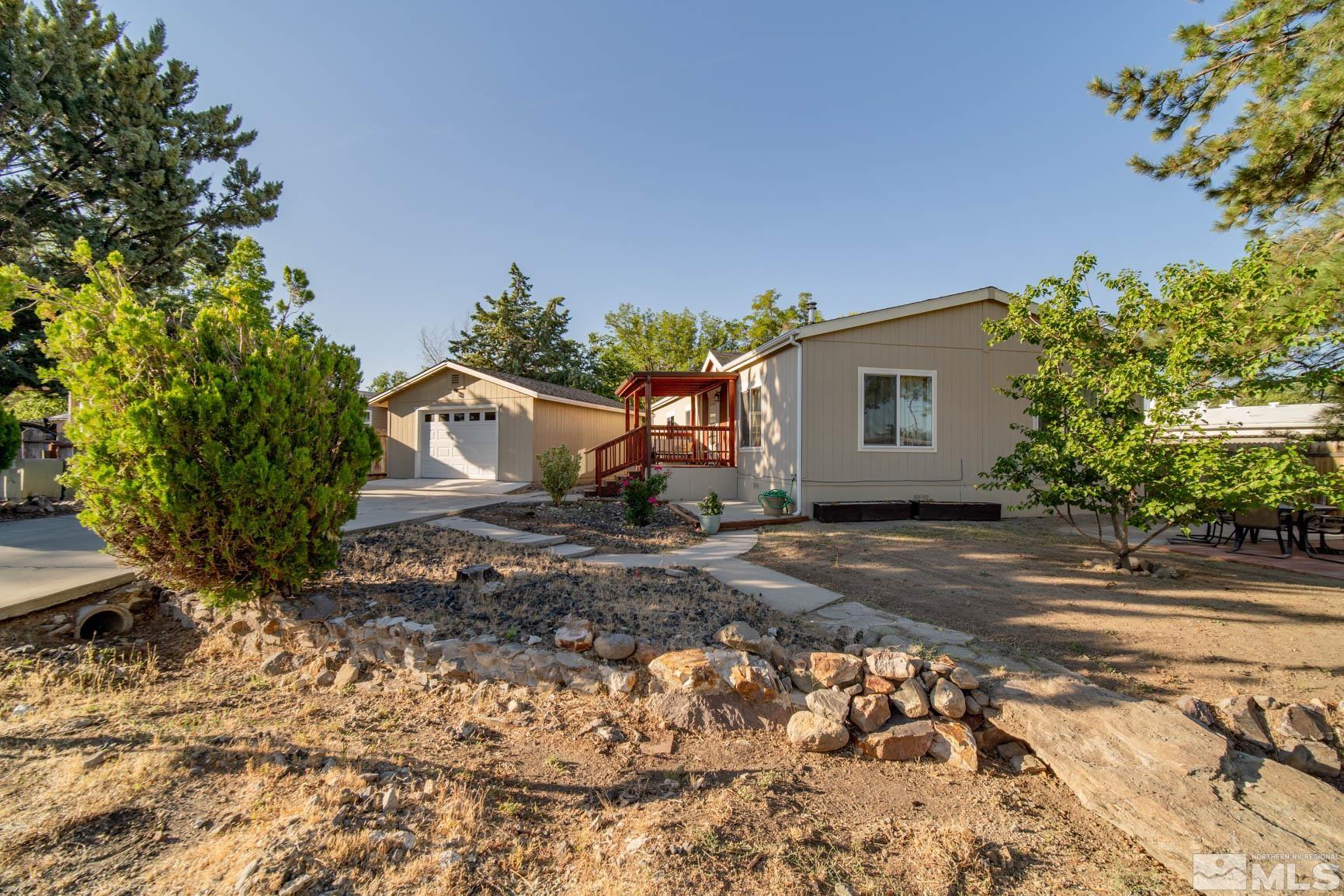 16210 Rhyolite Circle Reno, NV 89521 - Photo 3 of 39 a front view of a house with garden