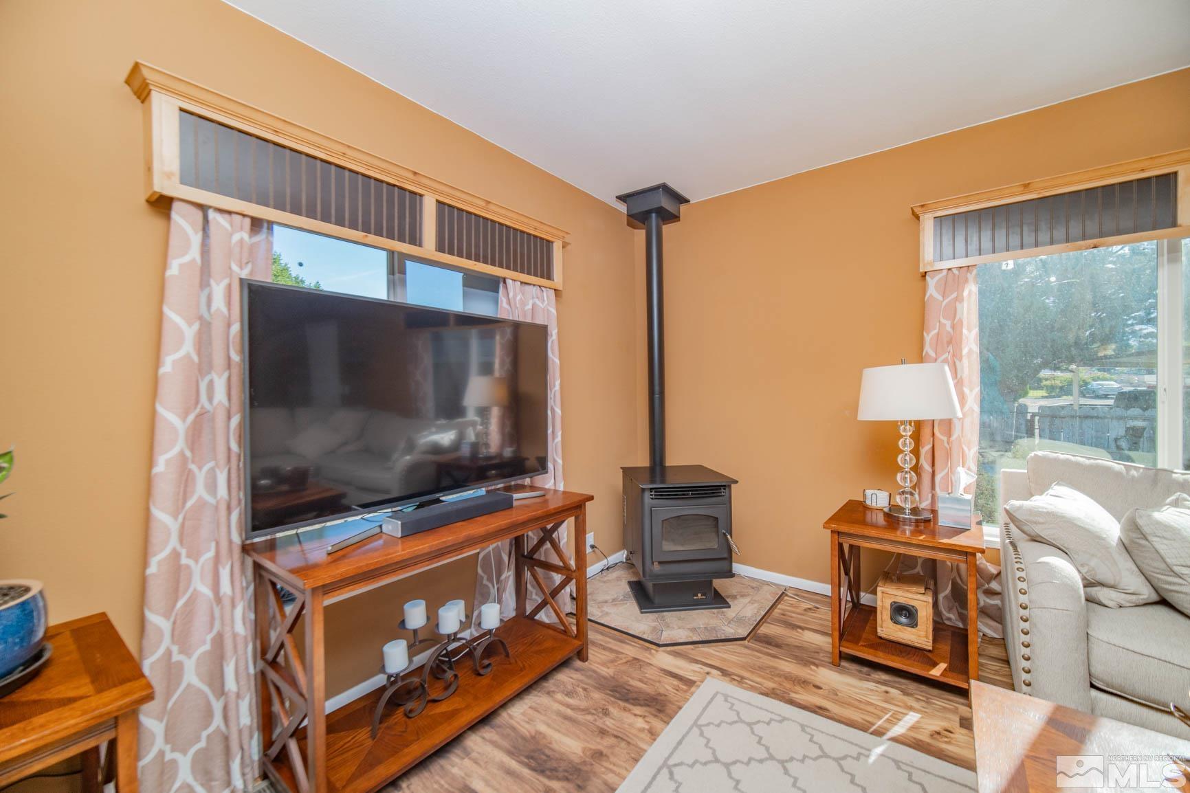 16210 Rhyolite Circle Reno, NV 89521 - Photo 6 of 39 a living room with furniture and a flat screen tv