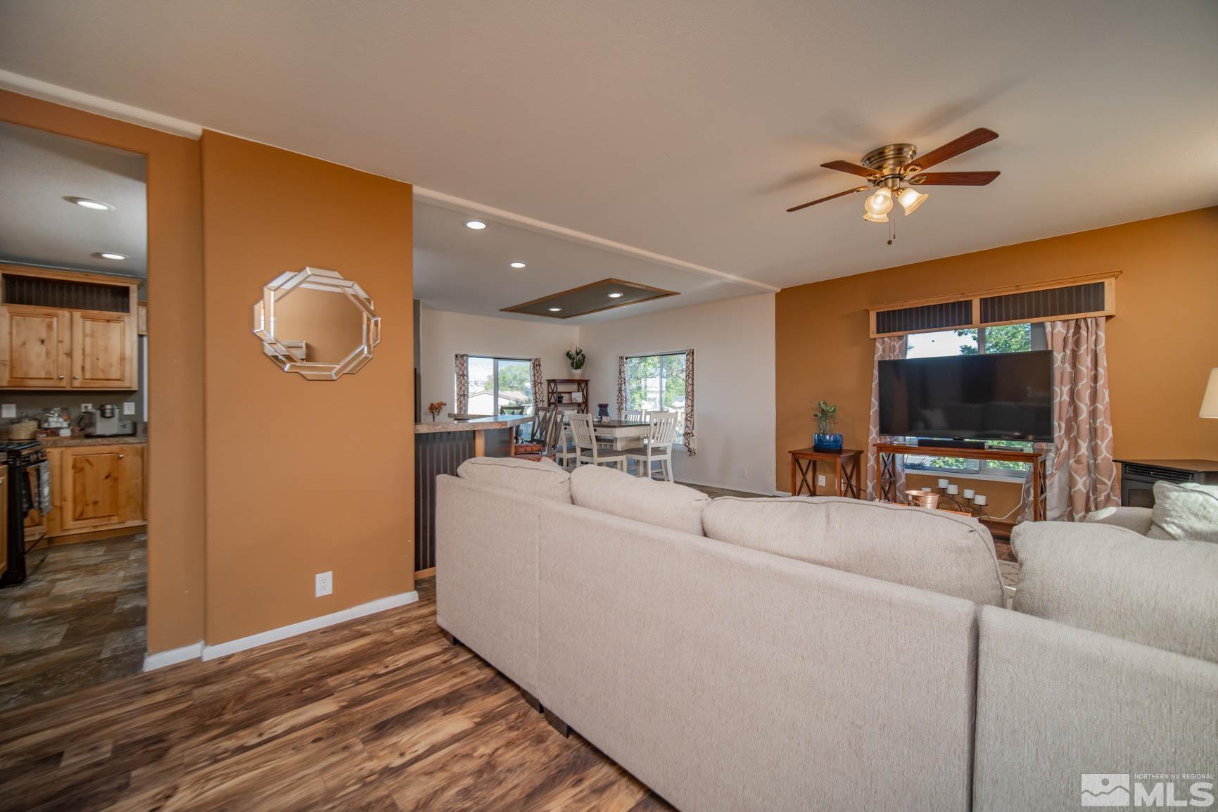 16210 Rhyolite Circle Reno, NV 89521 - Photo 8 of 39 a living room with furniture and a flat screen tv