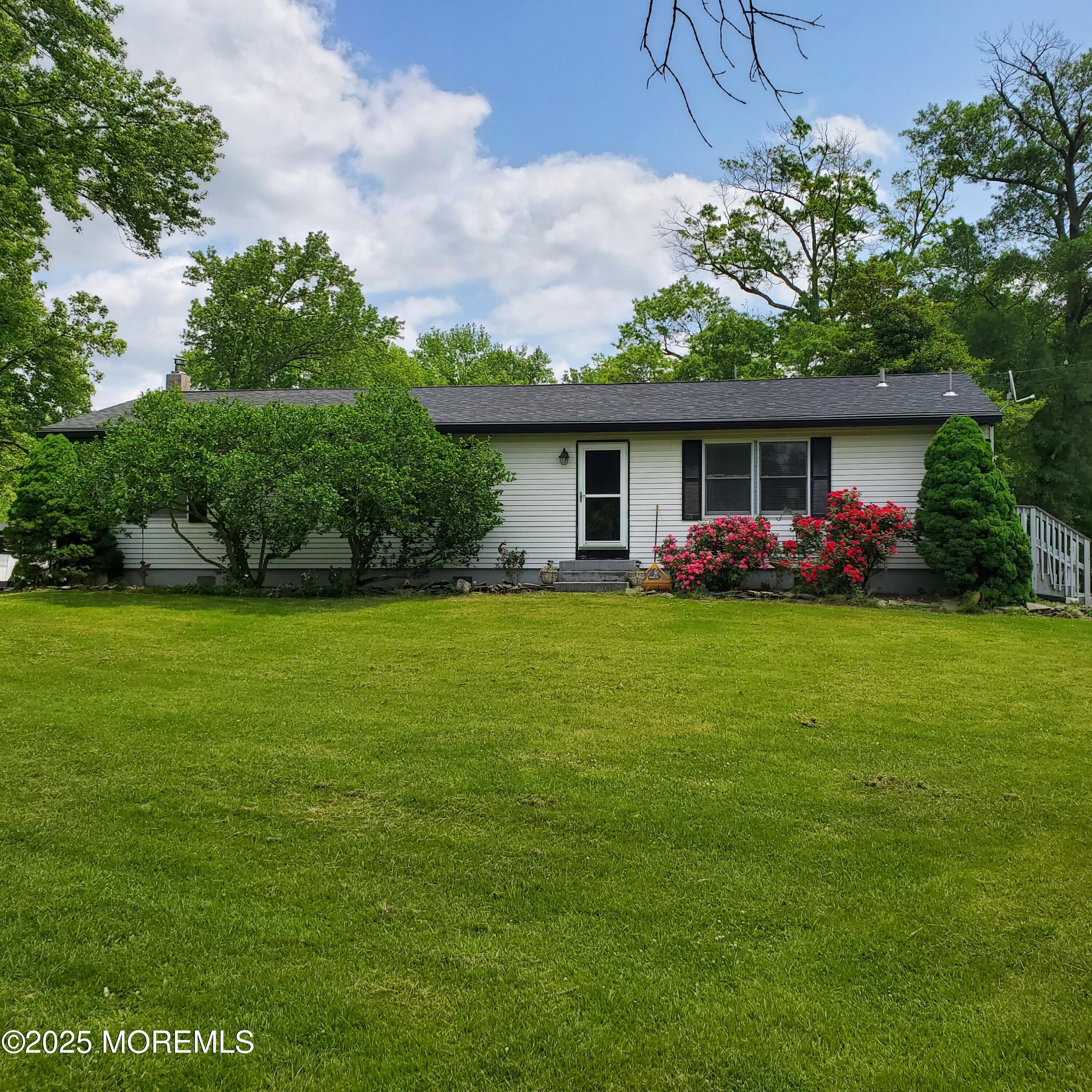 2328 Monmouth Road Jobstown, NJ 08041 - Photo 2 of 54 a front view of house with yard and green space