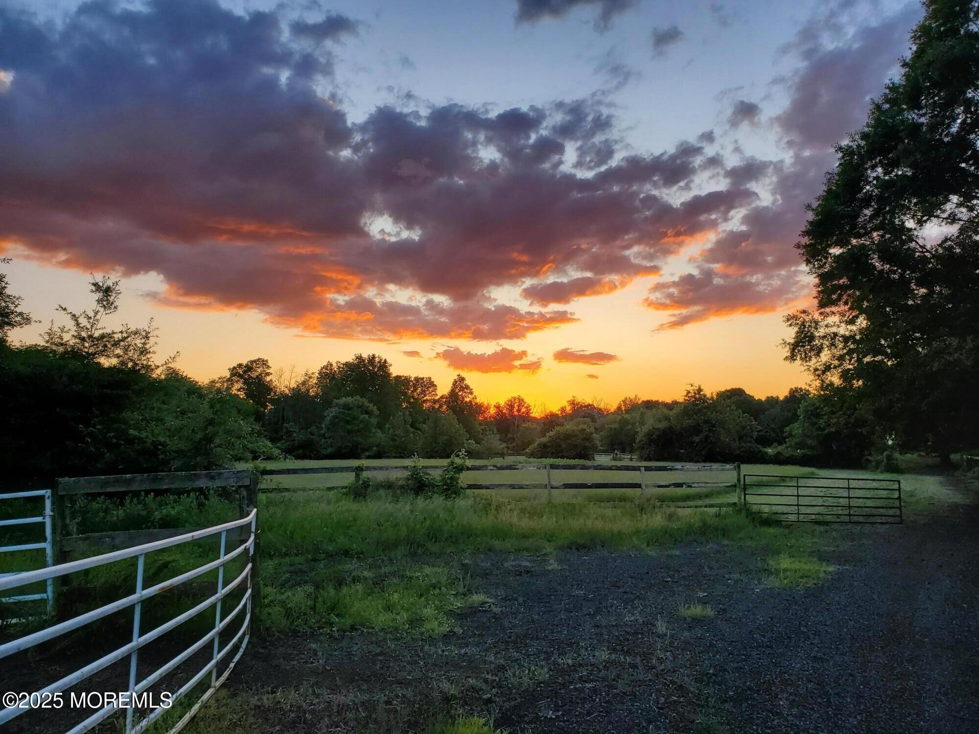 2328 Monmouth Road Jobstown, NJ 08041 - Photo 22 of 54 a view of a green field with wooden fence