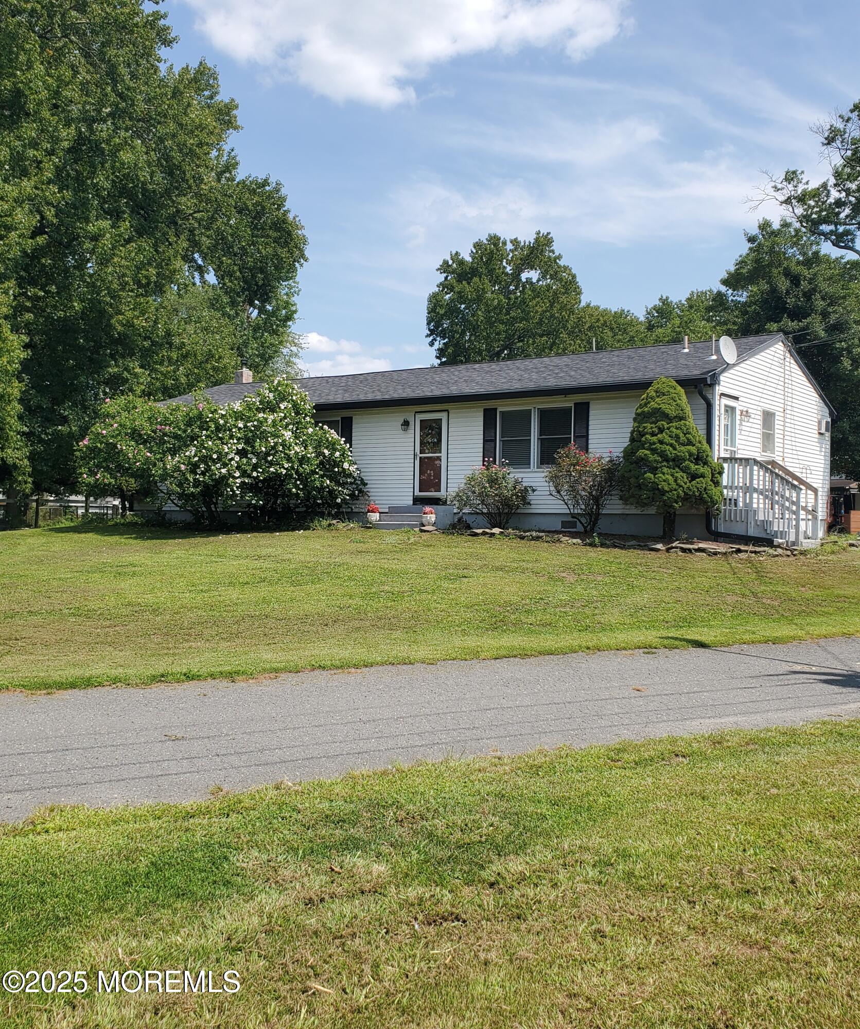 2328 Monmouth Road Jobstown, NJ 08041 - Photo 3 of 54 a view of a house with a yard and potted plants