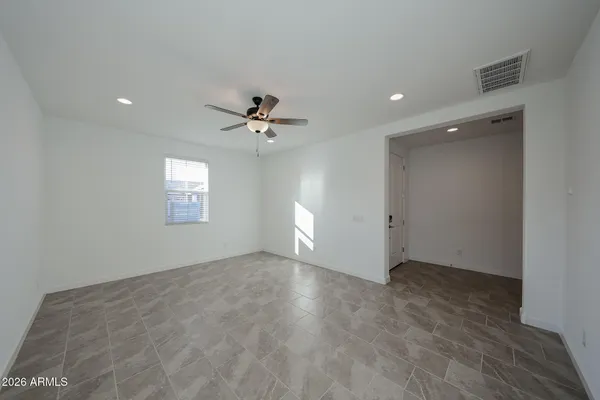 a view of an empty room with a window