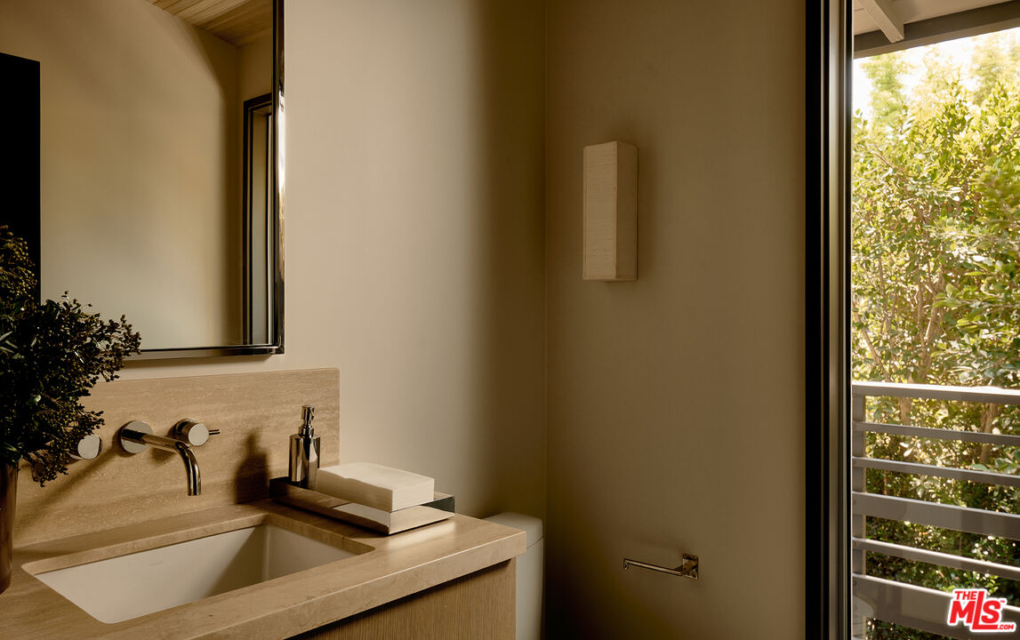 790 Burleigh Drive Pasadena, CA 91105 - Photo 19 of 47 a bathroom with a sink and a mirror