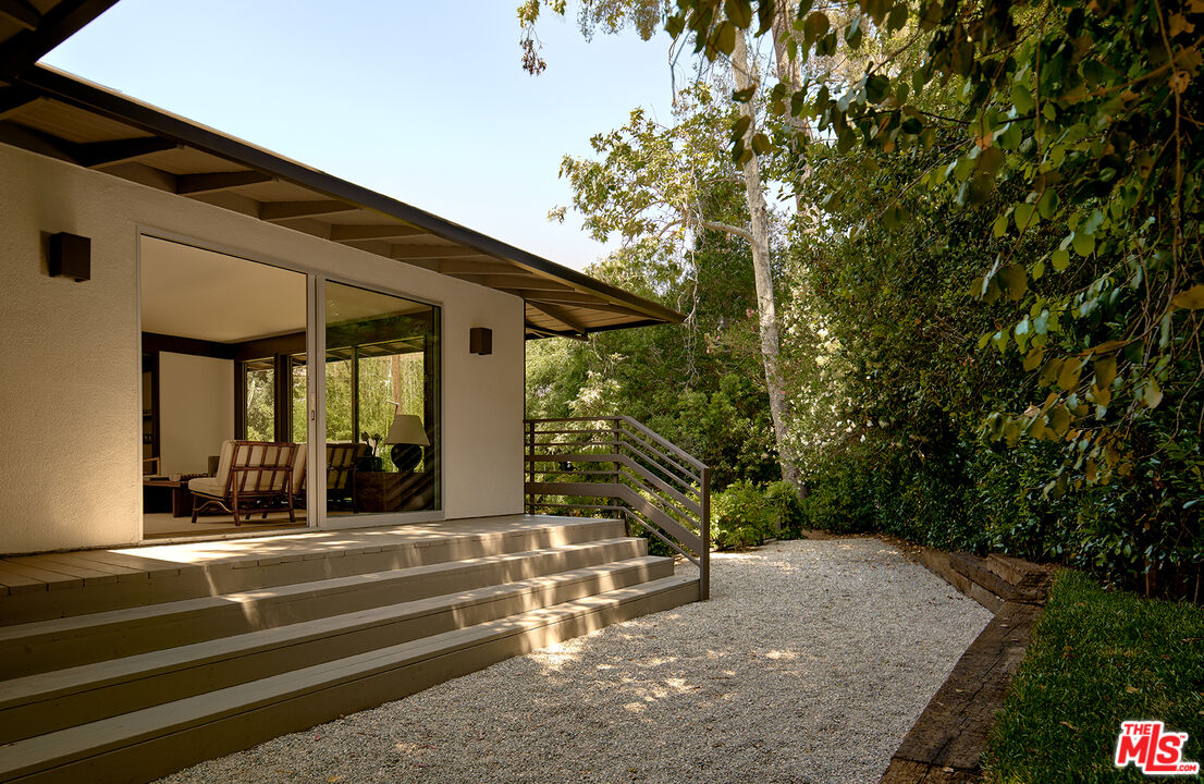 790 Burleigh Drive Pasadena, CA 91105 - Photo 36 of 47 a view of a house with a large window and plants