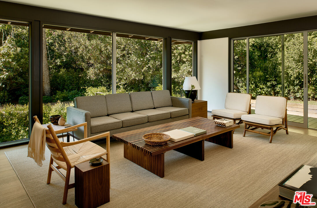 790 Burleigh Drive Pasadena, CA 91105 - Photo 7 of 47 a living room with furniture and a floor to ceiling window