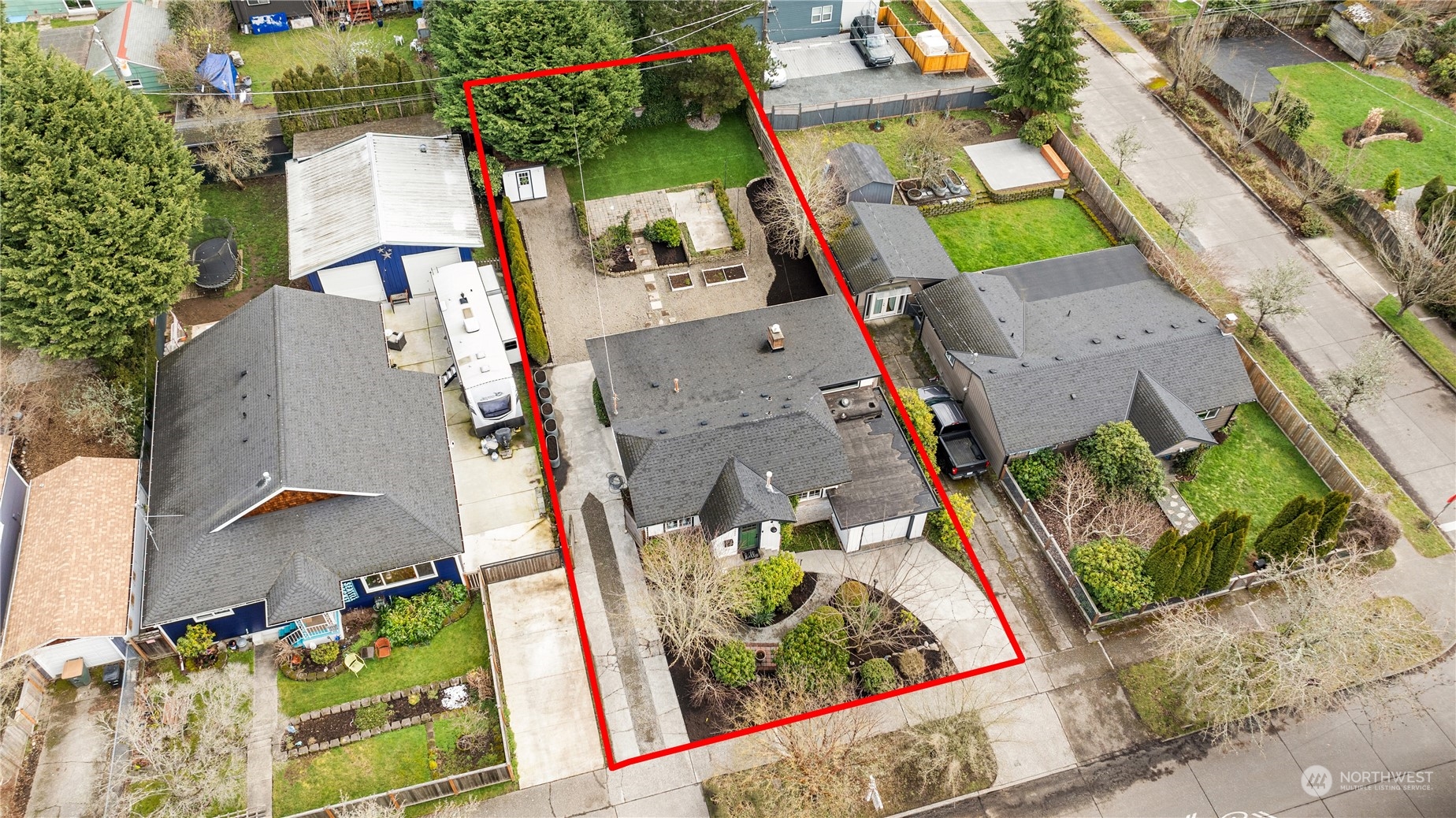 8850 30th Avenue Southwest Seattle, WA 98126 - Photo 2 of 39 an aerial view of a house with a swimming pool