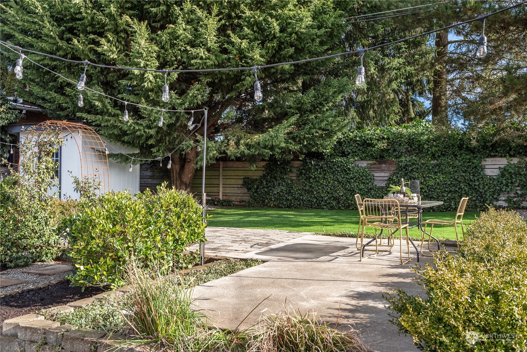 8850 30th Avenue Southwest Seattle, WA 98126 - Photo 31 of 39 a view of a chair and table in the garden