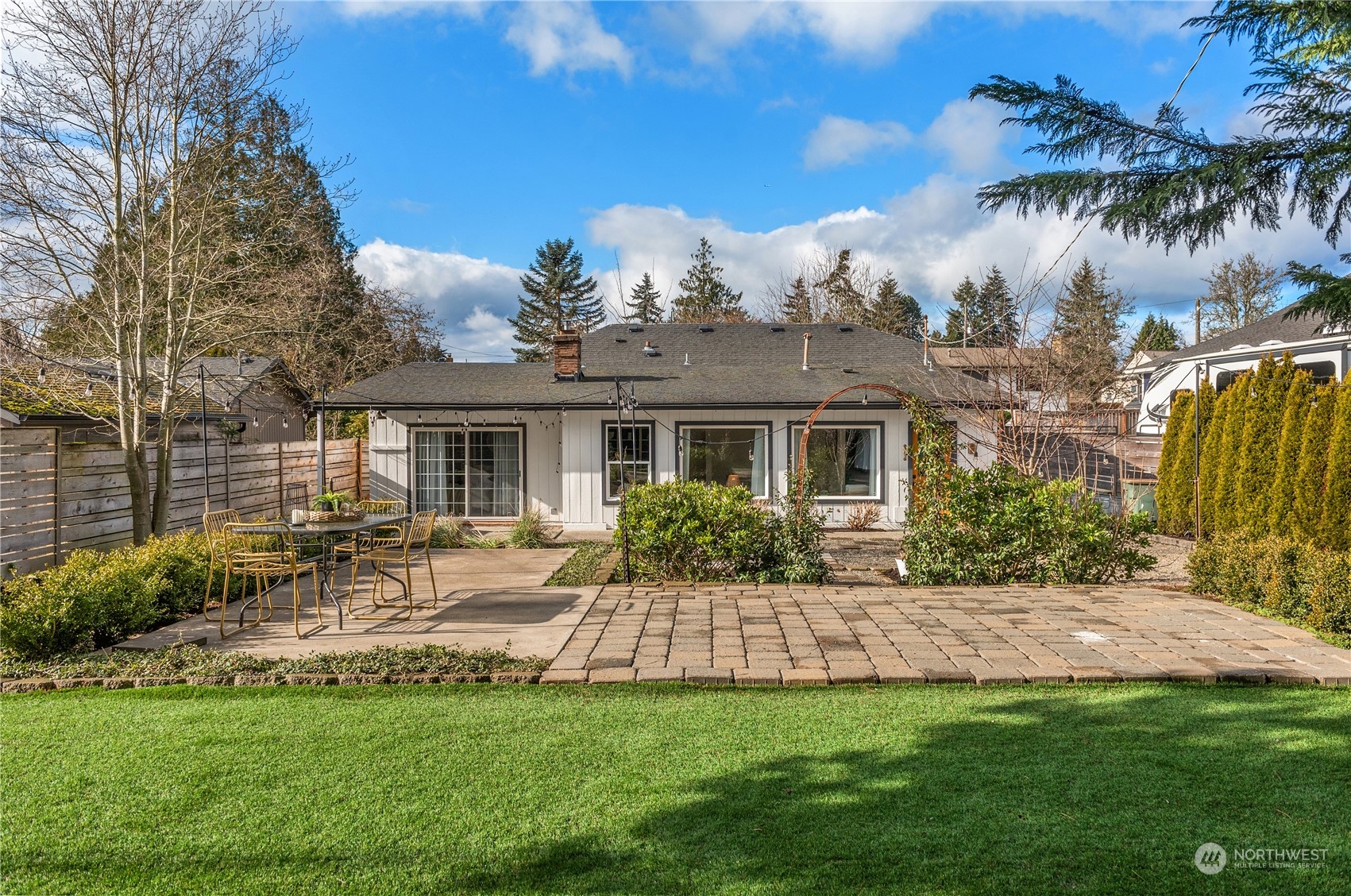 8850 30th Avenue Southwest Seattle, WA 98126 - Photo 33 of 39 a front view of house with yard and green space