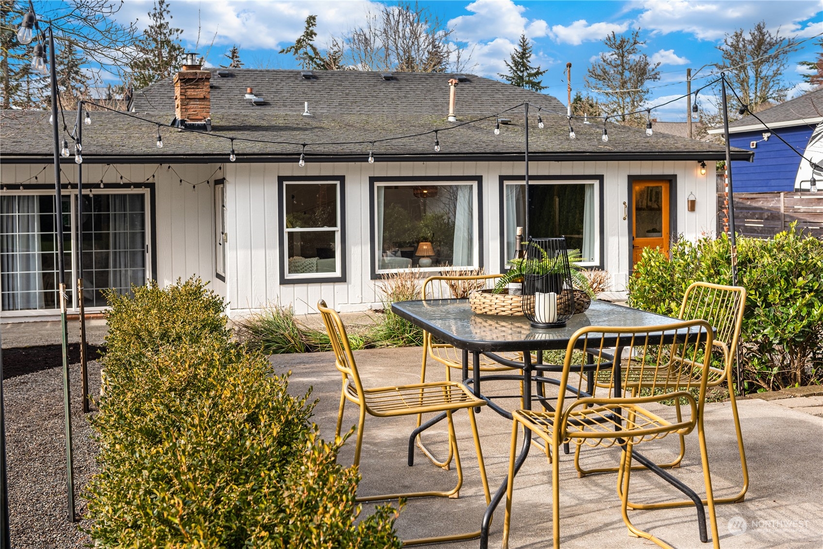 8850 30th Avenue Southwest Seattle, WA 98126 - Photo 35 of 39 a view of a patio with table and chairs and potted plants