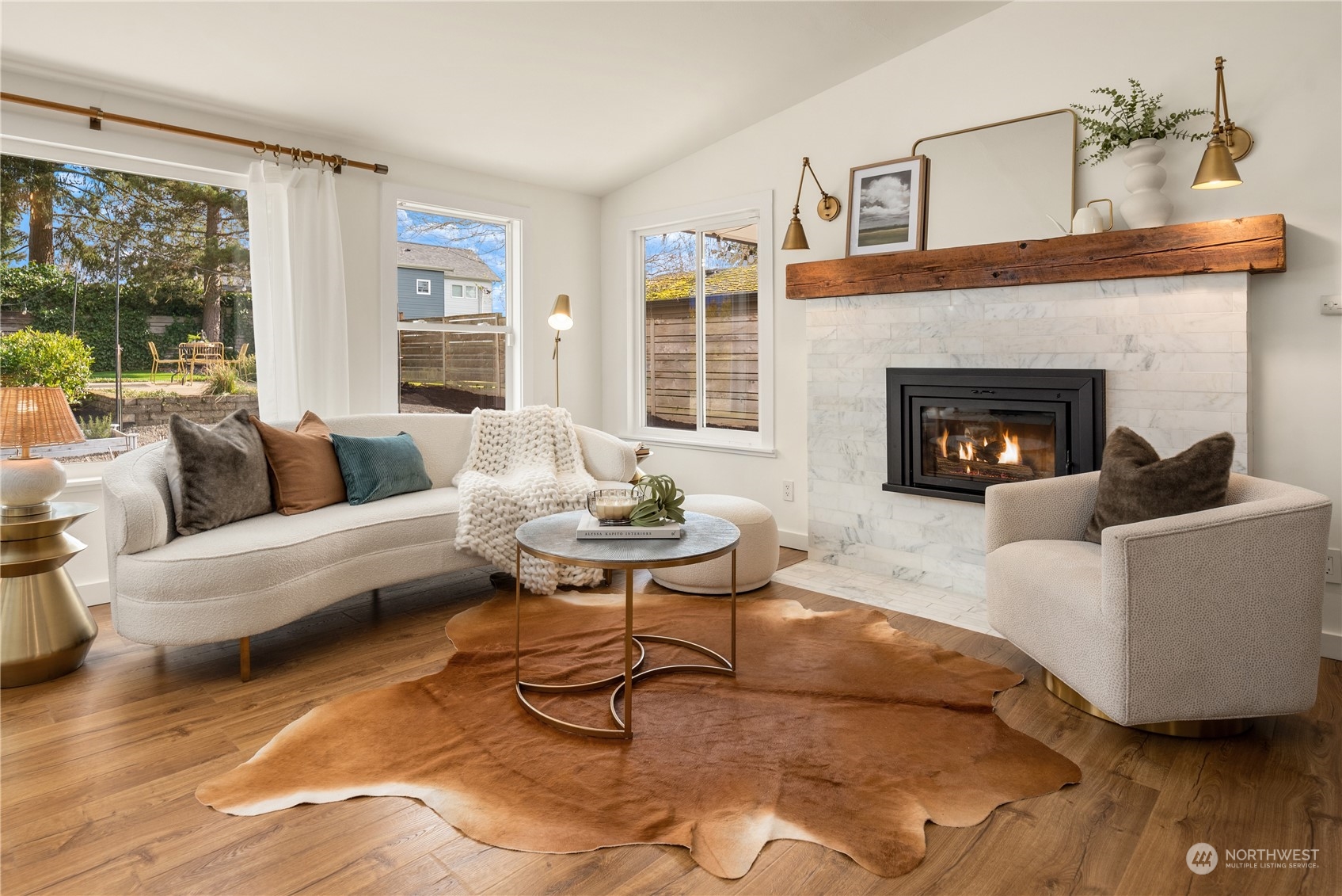8850 30th Avenue Southwest Seattle, WA 98126 - Photo 6 of 39 a living room with furniture and a fireplace