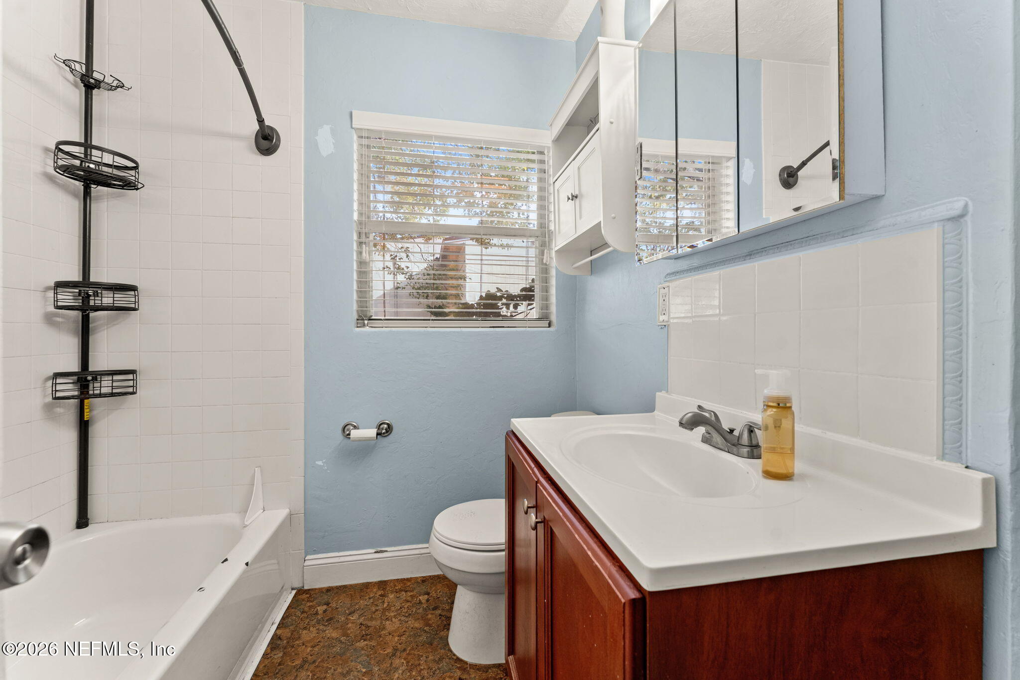 5331 Sharon Terrace Jacksonville, FL 32207 - Photo 11 of 16 a bathroom with a sink a toilet and shower