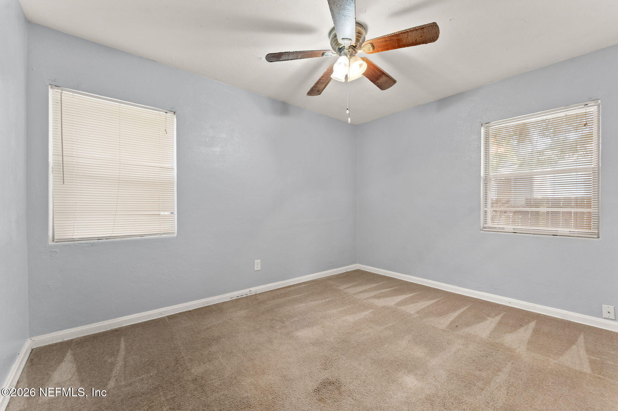 5331 Sharon Terrace Jacksonville, FL 32207 - Photo 8 of 16 an empty room with a window and a fan