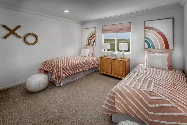 a bedroom with bed and a window