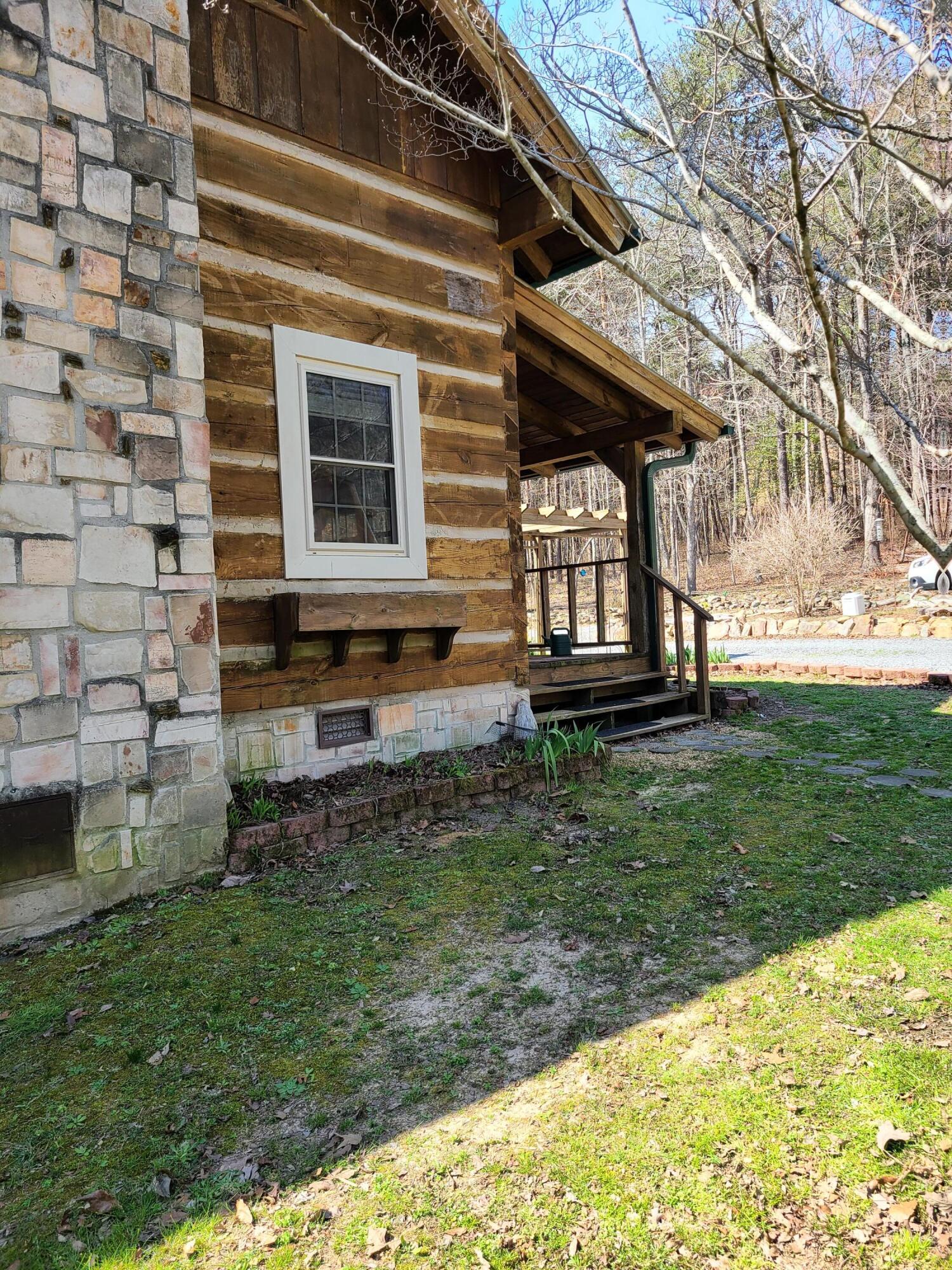 1213 Murdock Road Northeast Fort Payne, AL 35967 - Photo 1 of 5 fireplace side of cabin