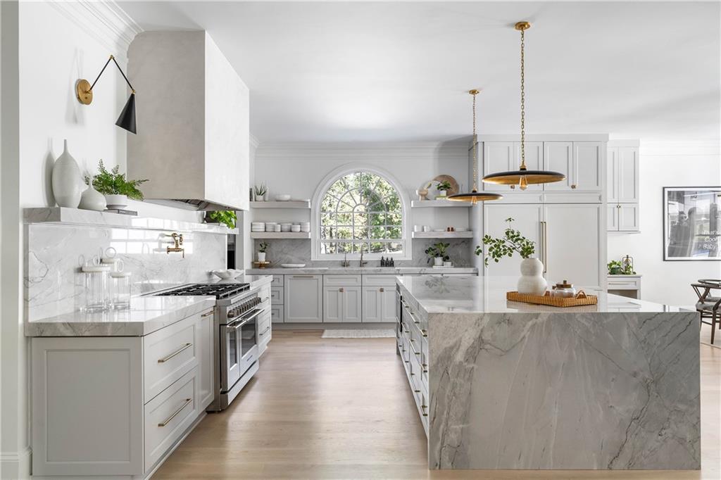 7160 Bennett Road Cumming, GA 30041 - Photo 11 of 83 a kitchen with stainless steel appliances granite countertop a stove a sink and a refrigerator