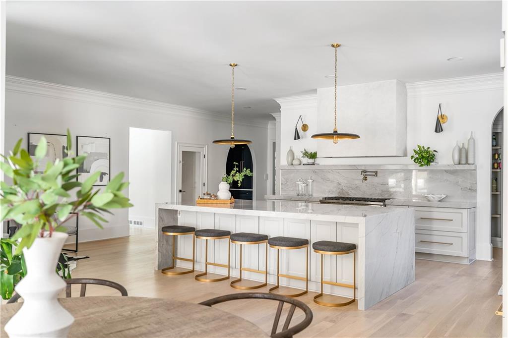 7160 Bennett Road Cumming, GA 30041 - Photo 13 of 83 a kitchen with granite countertop white cabinets and stainless steel appliances