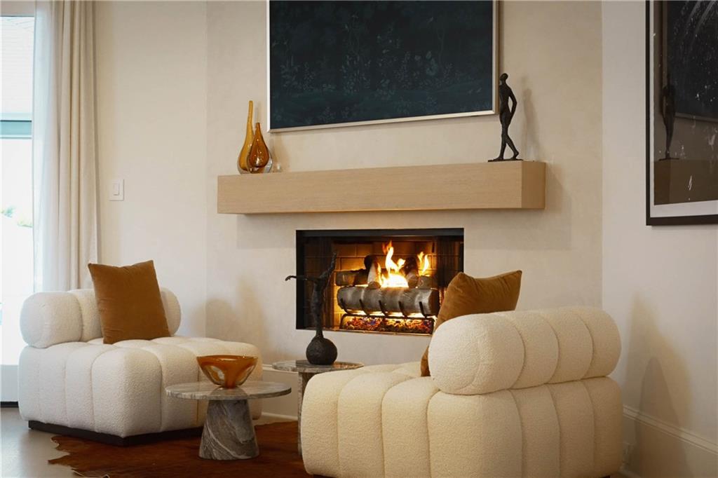 7160 Bennett Road Cumming, GA 30041 - Photo 25 of 83 a living room with furniture and a fireplace