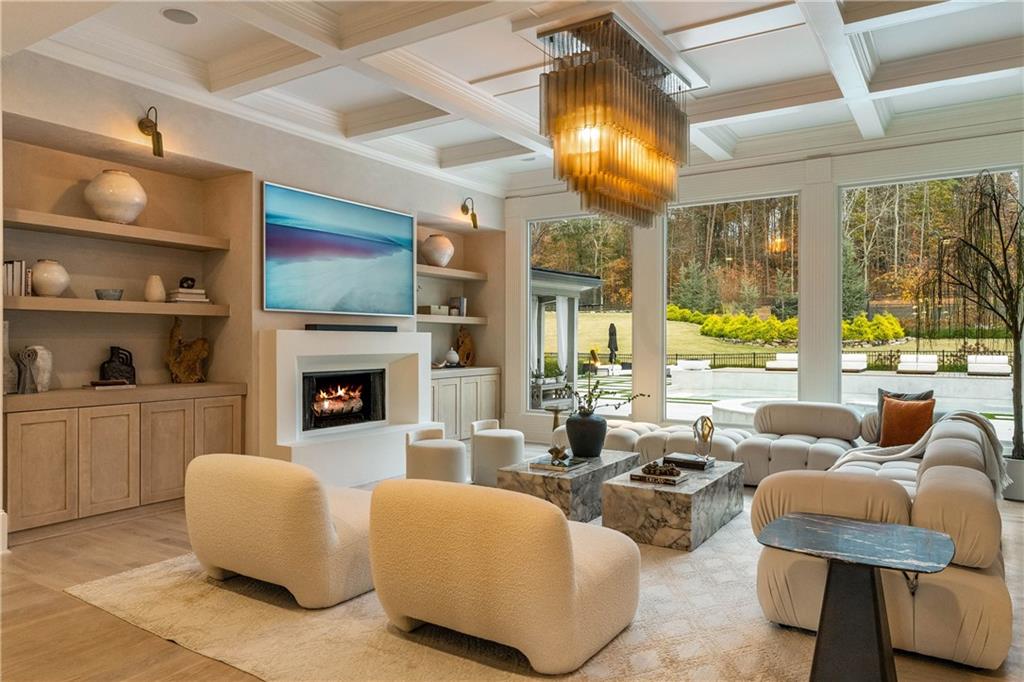 7160 Bennett Road Cumming, GA 30041 - Photo 29 of 83 a living room with fireplace furniture and a large window
