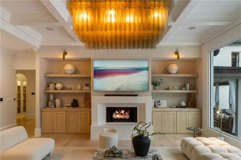 7160 Bennett Road Cumming, GA 30041 - Photo 31 of 83 a living room with furniture and a fireplace