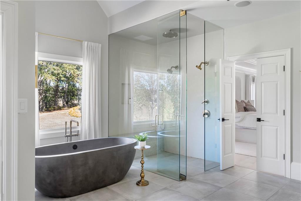 7160 Bennett Road Cumming, GA 30041 - Photo 36 of 83 a living room with a bathtub and a shower