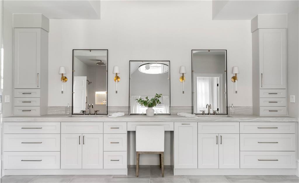 7160 Bennett Road Cumming, GA 30041 - Photo 37 of 83 a bathroom with a double vanity sink and a mirror