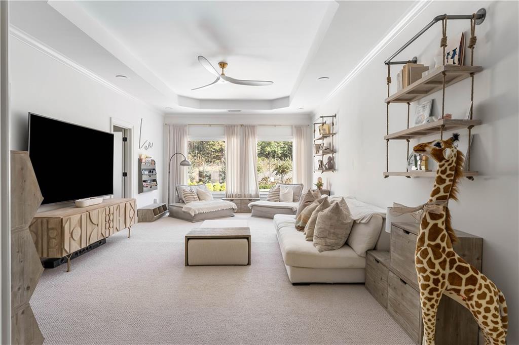 7160 Bennett Road Cumming, GA 30041 - Photo 46 of 83 a living room with furniture and a flat screen tv