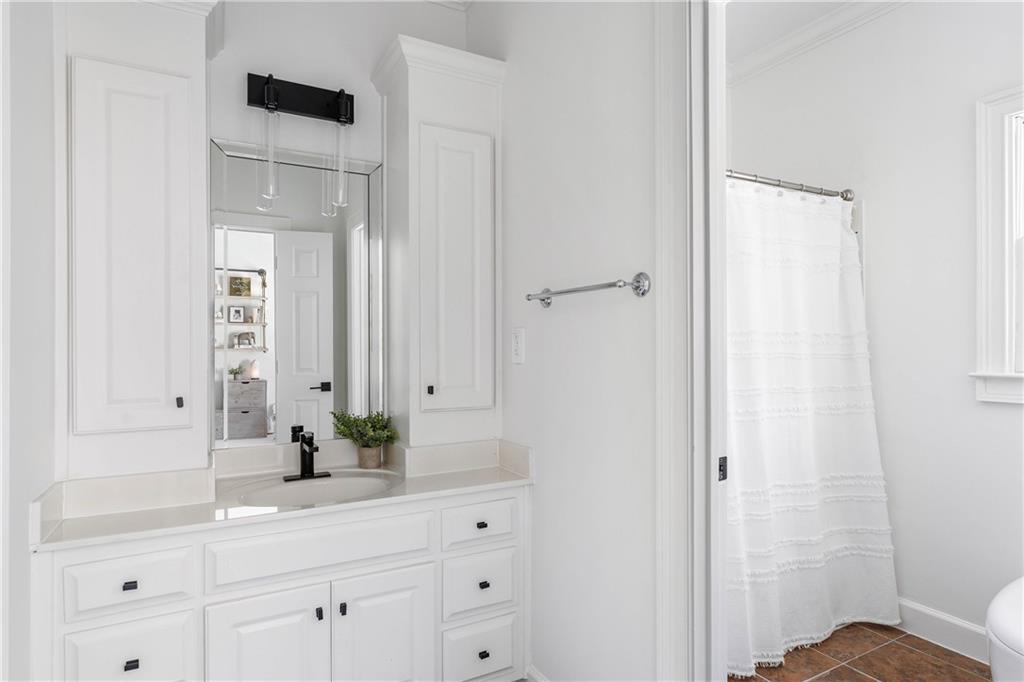 7160 Bennett Road Cumming, GA 30041 - Photo 47 of 83 a bathroom with a sink and a mirror