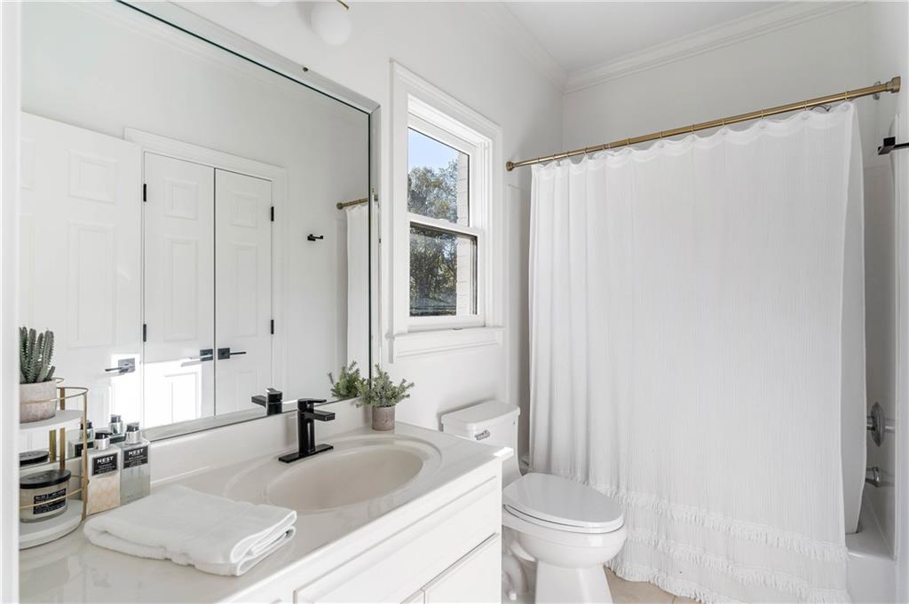 7160 Bennett Road Cumming, GA 30041 - Photo 52 of 83 a bathroom with a sink toilet and shower