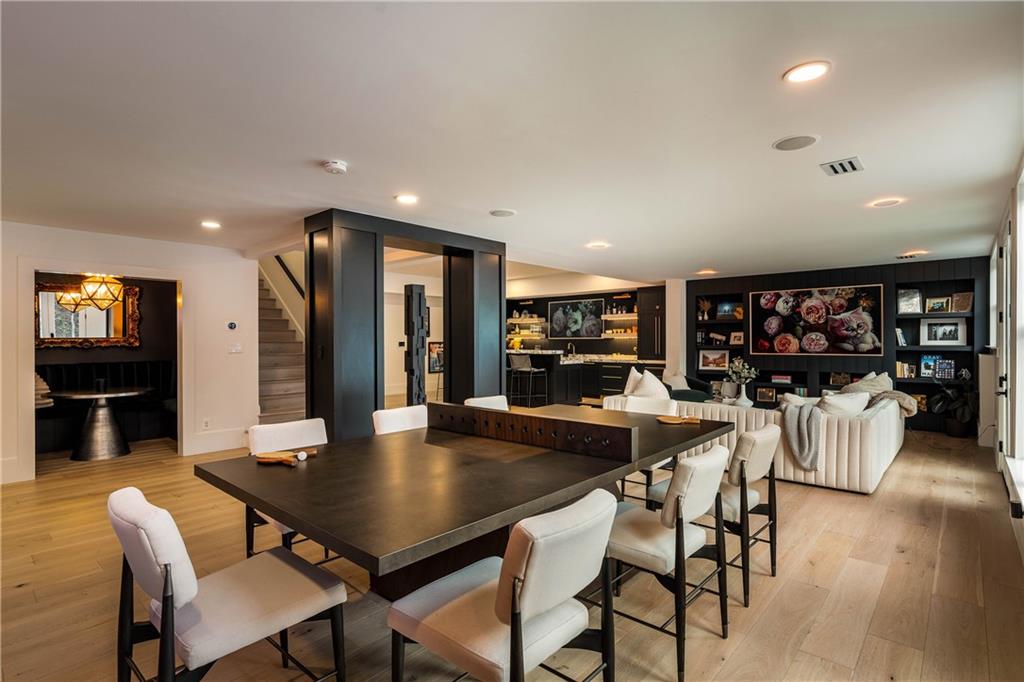 7160 Bennett Road Cumming, GA 30041 - Photo 53 of 83 a view of a dining room with furniture and wooden floor