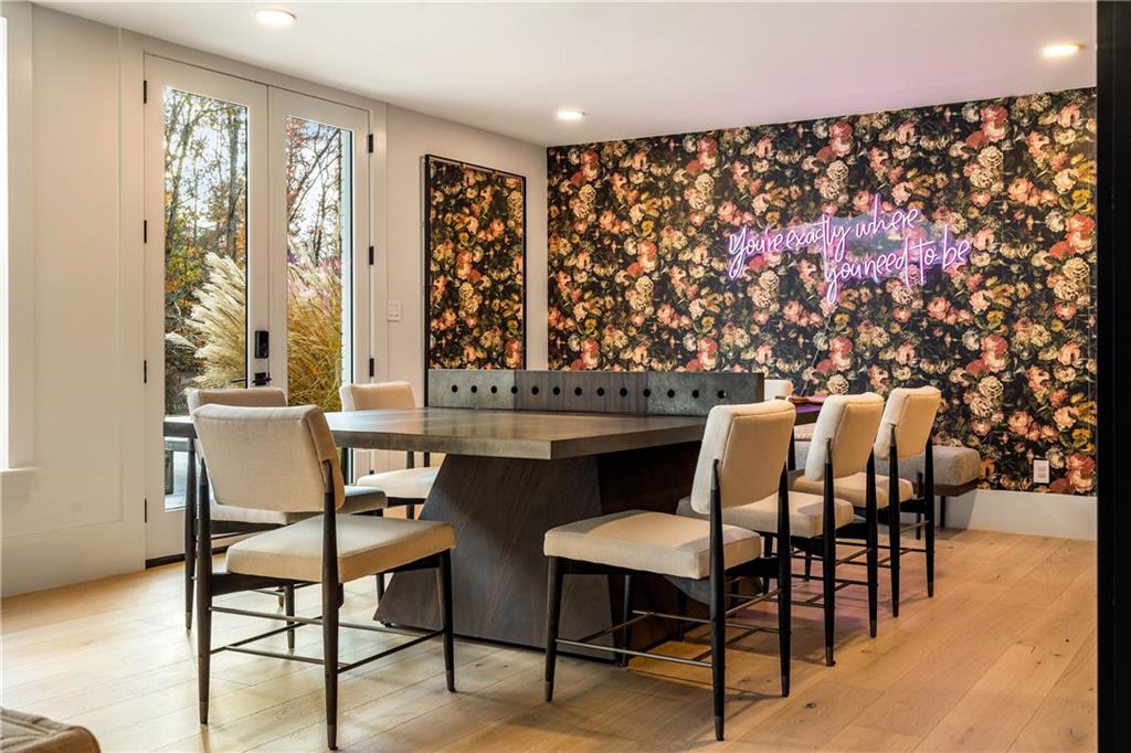 7160 Bennett Road Cumming, GA 30041 - Photo 55 of 83 a dining room with furniture and wooden floor
