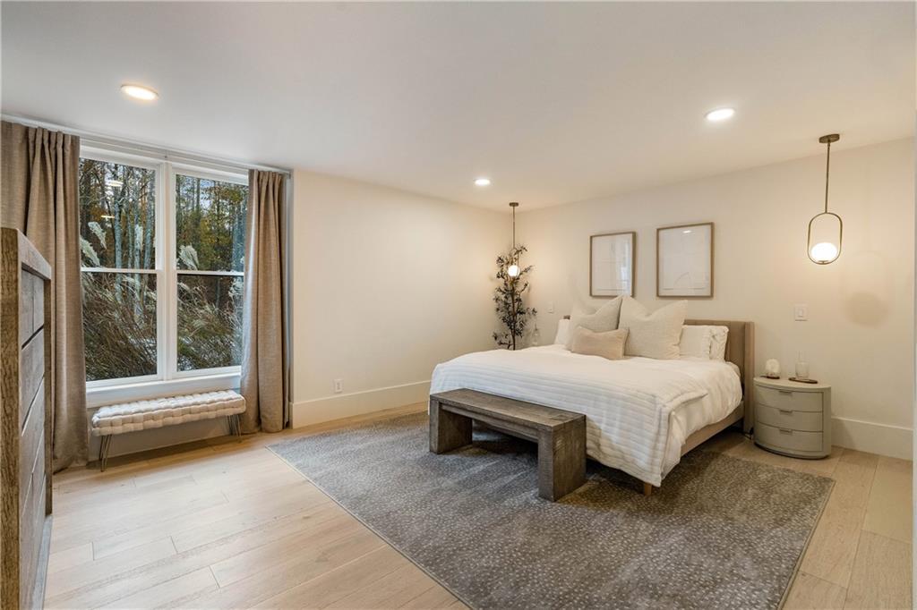 7160 Bennett Road Cumming, GA 30041 - Photo 67 of 83 a spacious bedroom with a bed and a window